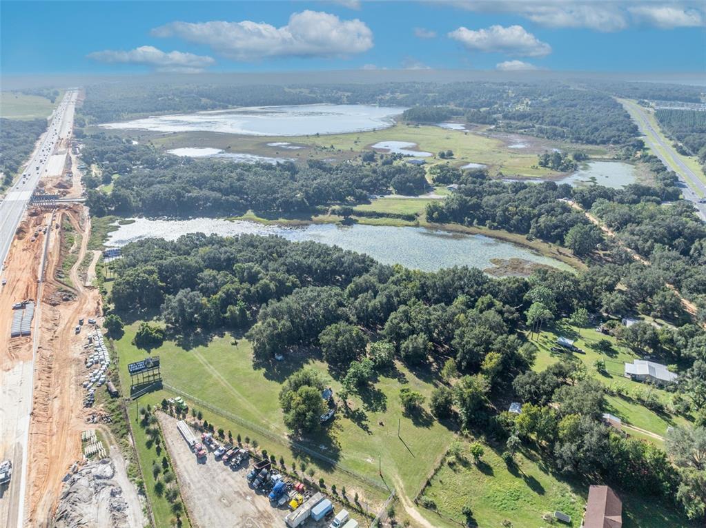 19048 Causey Road Clermont, FL 34715 - Photo 16 of 36 a view of lake with beach