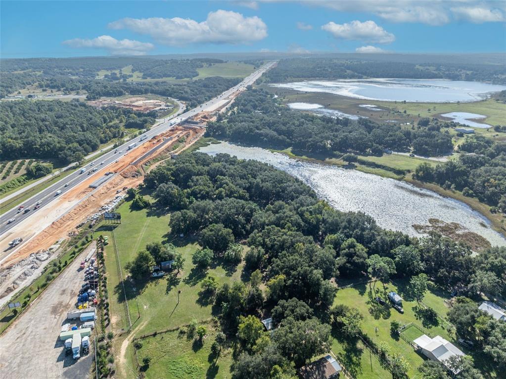 19048 Causey Road Clermont, FL 34715 - Photo 19 of 36 a view of a lake with a city