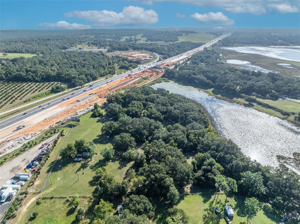 19048 Causey Road Clermont, FL 34715 - Photo 20 of 36 a view of a yard with a wooden fence
