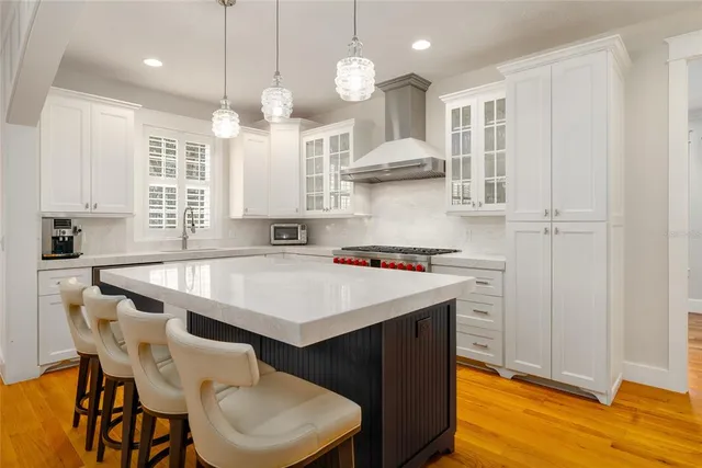 a bathroom with a granite countertop sink a toilet and shower