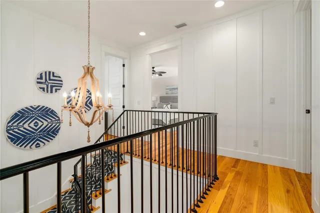 a bed room with a bed and a chandelier