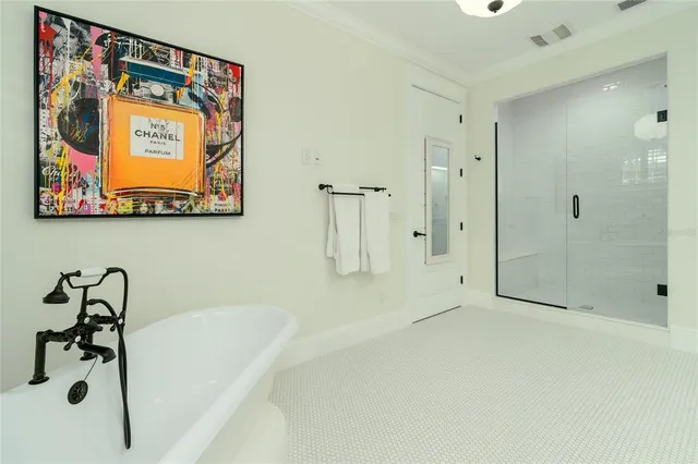 a view of a porch with a table and chairs