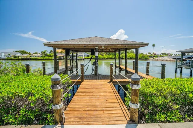 a view of a lake with houses in the background