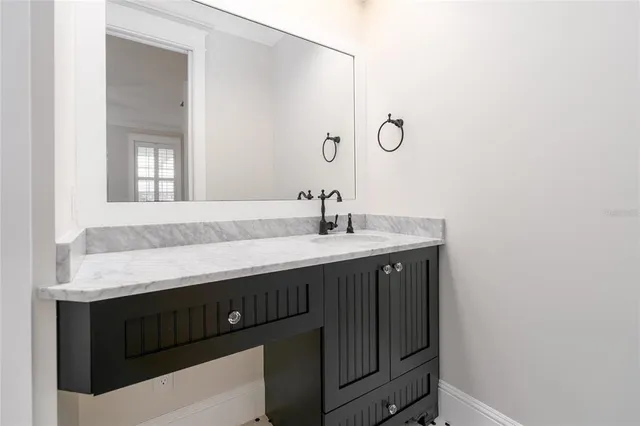 a view of swimming pool with a garden and plants