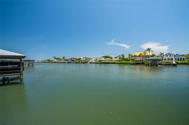 a view of a house with backyard sitting area and garden
