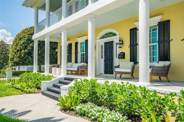 a view of a hallway with wooden floor and entryway
