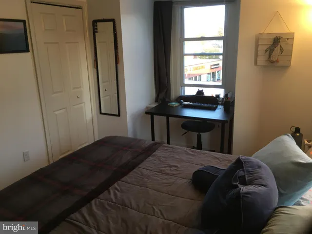 a view of a brick house with large windows