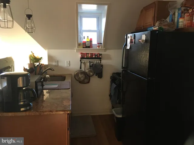 a close view of a stove top oven and cabinets