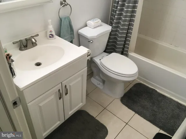 a bathroom with a bathtub and a toilet