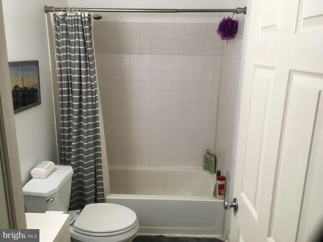 a en suite bathroom with a sink and a mirror