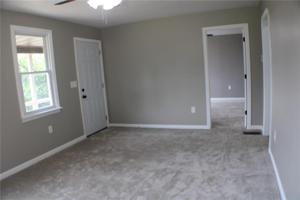 135 Truver Road Valencia, PA 16059 - Photo 11 of 36 The spacious living room with access to the front porch.