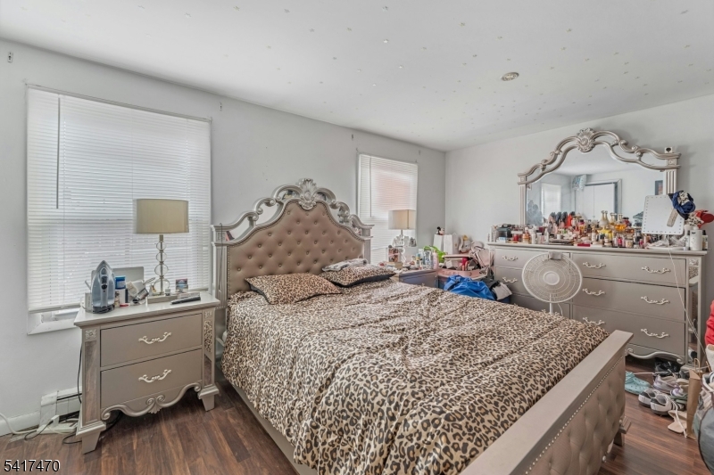 13 Allen Street Passaic, NJ 07055 - Photo 4 of 7 a bed room with a bed window and dresser