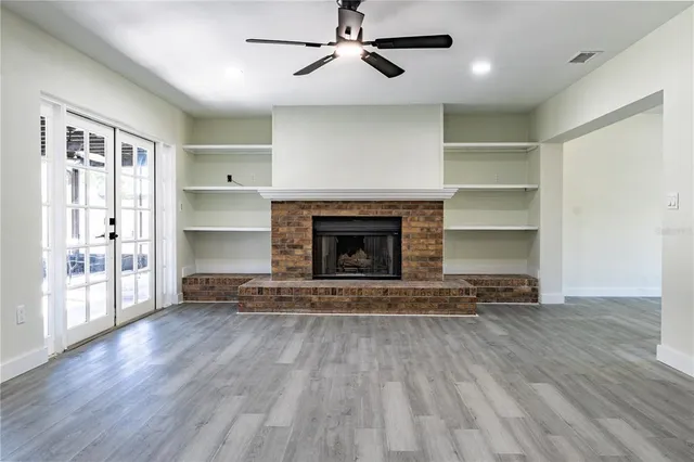 a view of an entryway with wooden floor