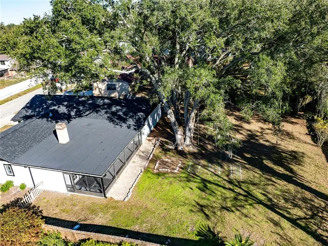 a kitchen with stainless steel appliances granite countertop a refrigerator a stove and a wooden floors