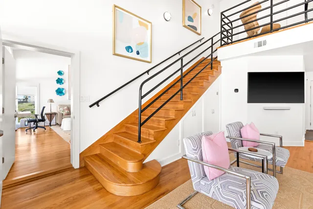 a view of entryway dining room and hall with wooden floor