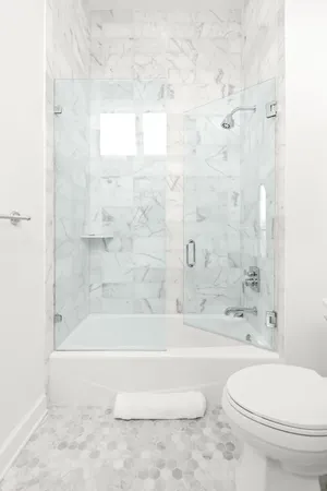 a bathroom with a bathtub and a toilet