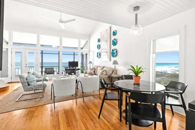 a view of a dining room with furniture window and wooden floor