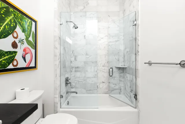 a bathroom with a bathtub and a shower