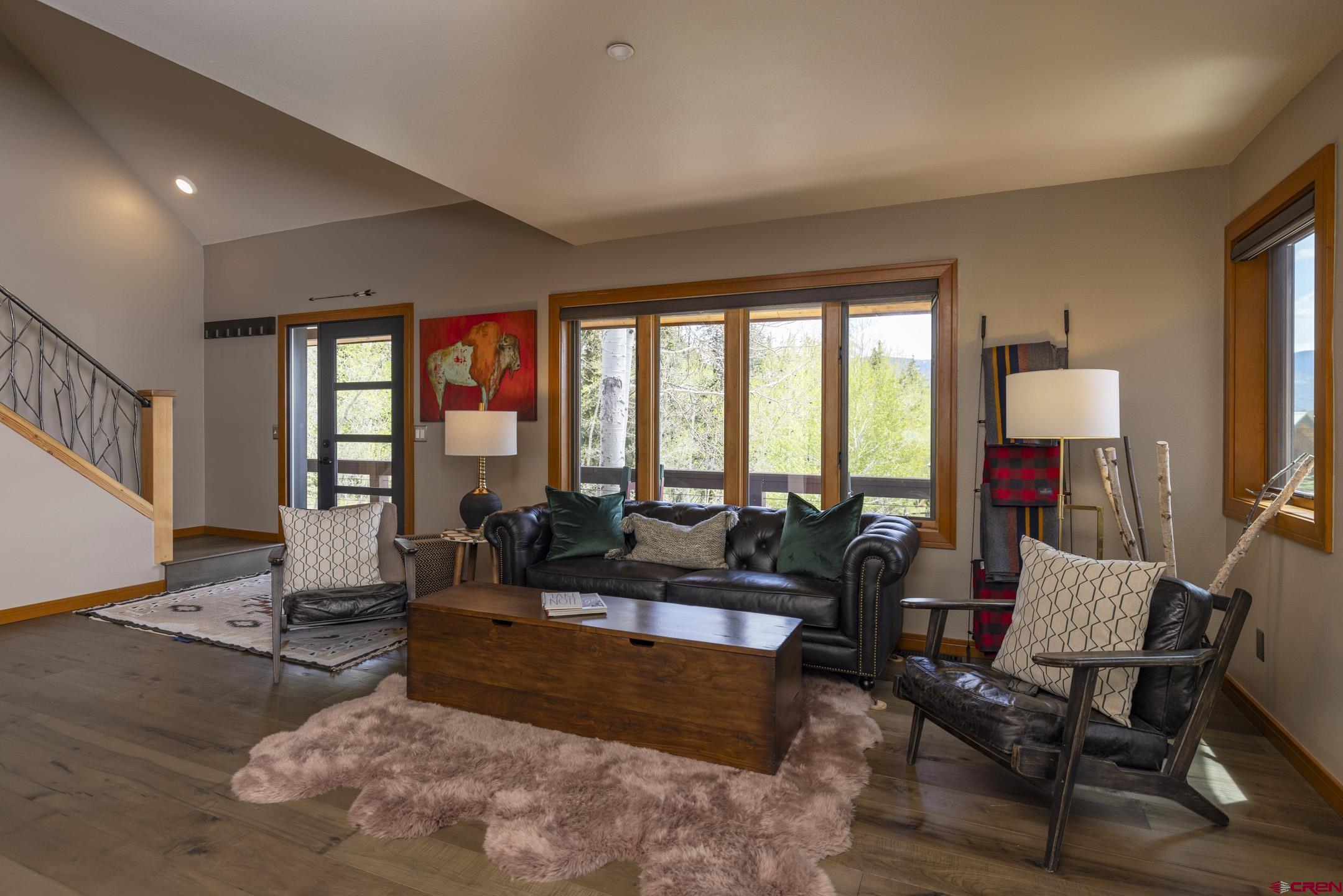 154 Falcon Ridge Road Durango, CO 81301 - Photo 10 of 42 a living room with furniture and a large window