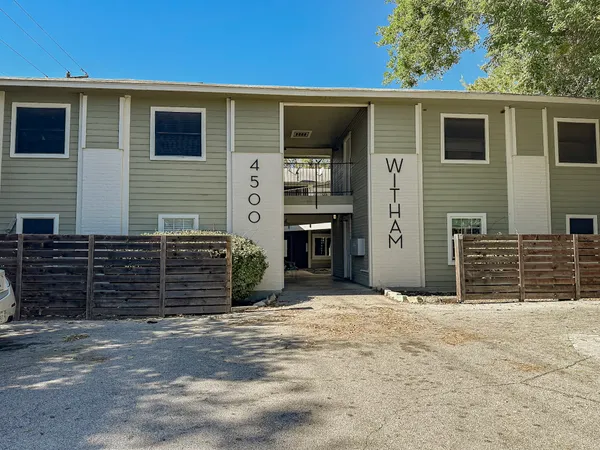 a front view of a house with a garage
