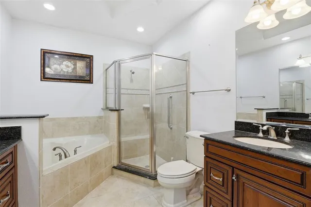 a bathroom with a sink a faucet a light fixture and a mirror