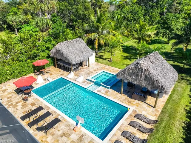 a view of a backyard with sitting area