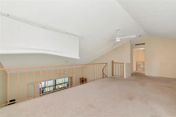a view of an empty room with stairs