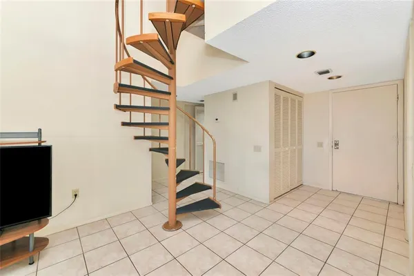 a view of entryway with stairs and white walls