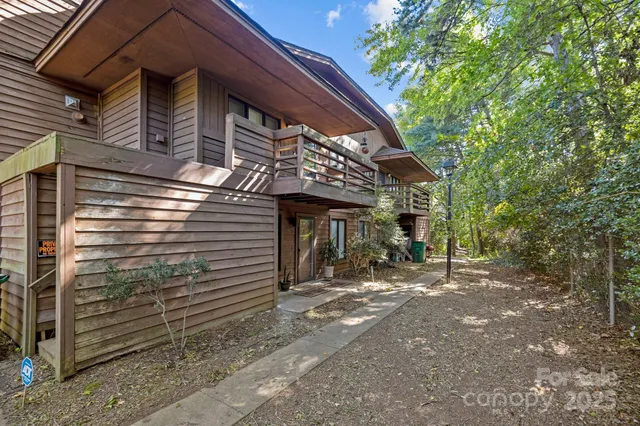 a view of a house with a tree