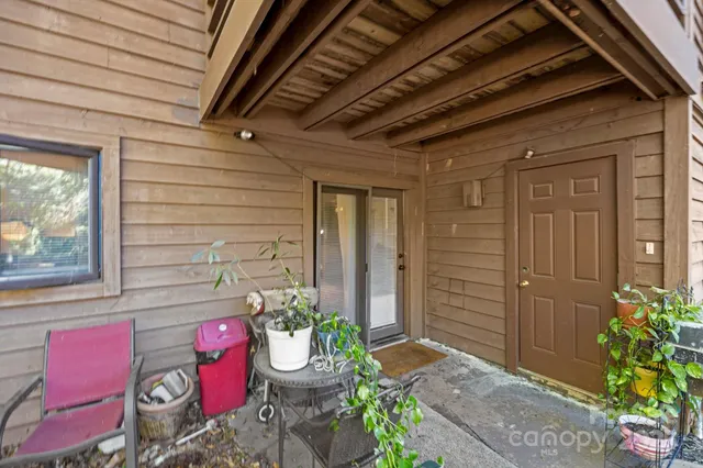 a front view of a house with chairs
