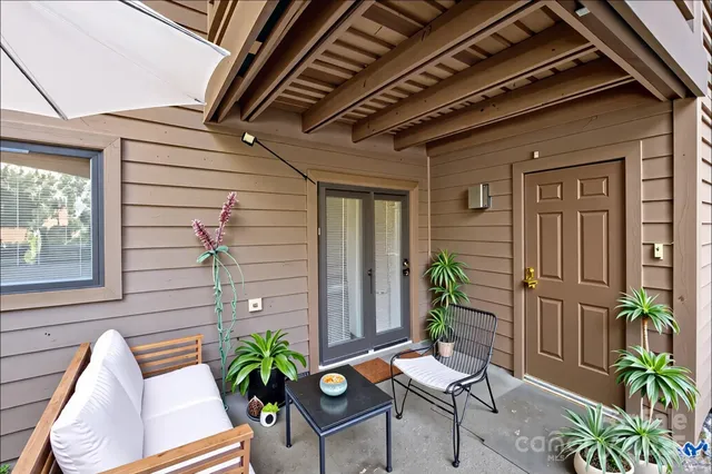 a view of a porch with seating space