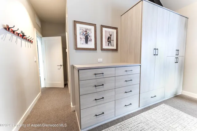 a view of a dresser with window