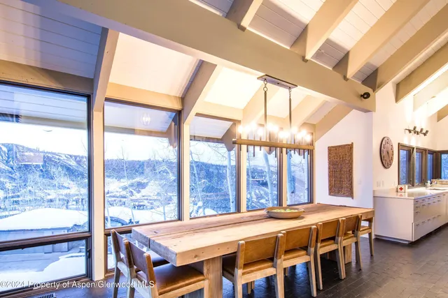 a room with a large window and a bed