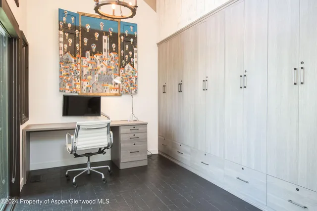 a workspace with furniture and a window