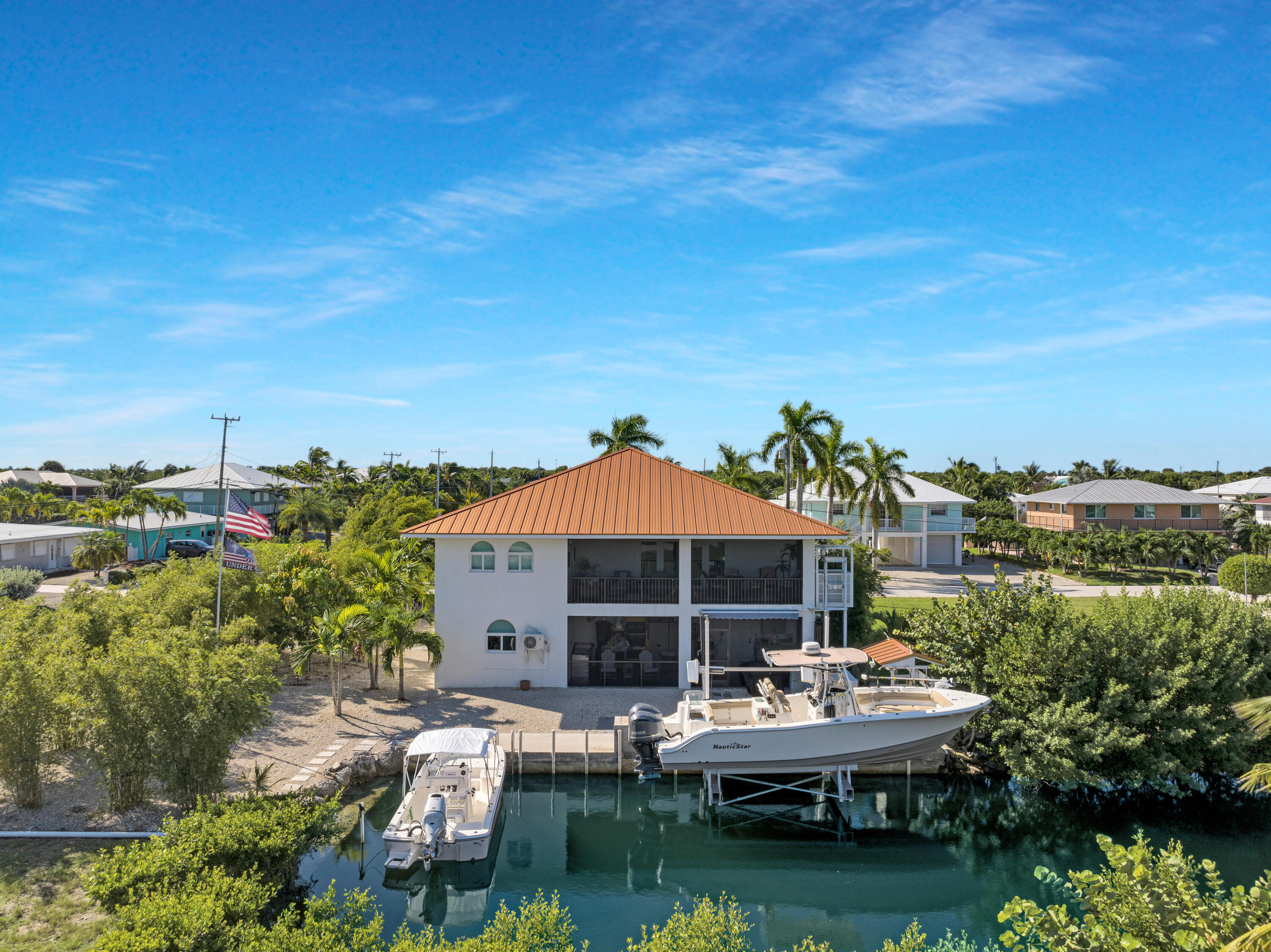 a view of a lake with couches and city view