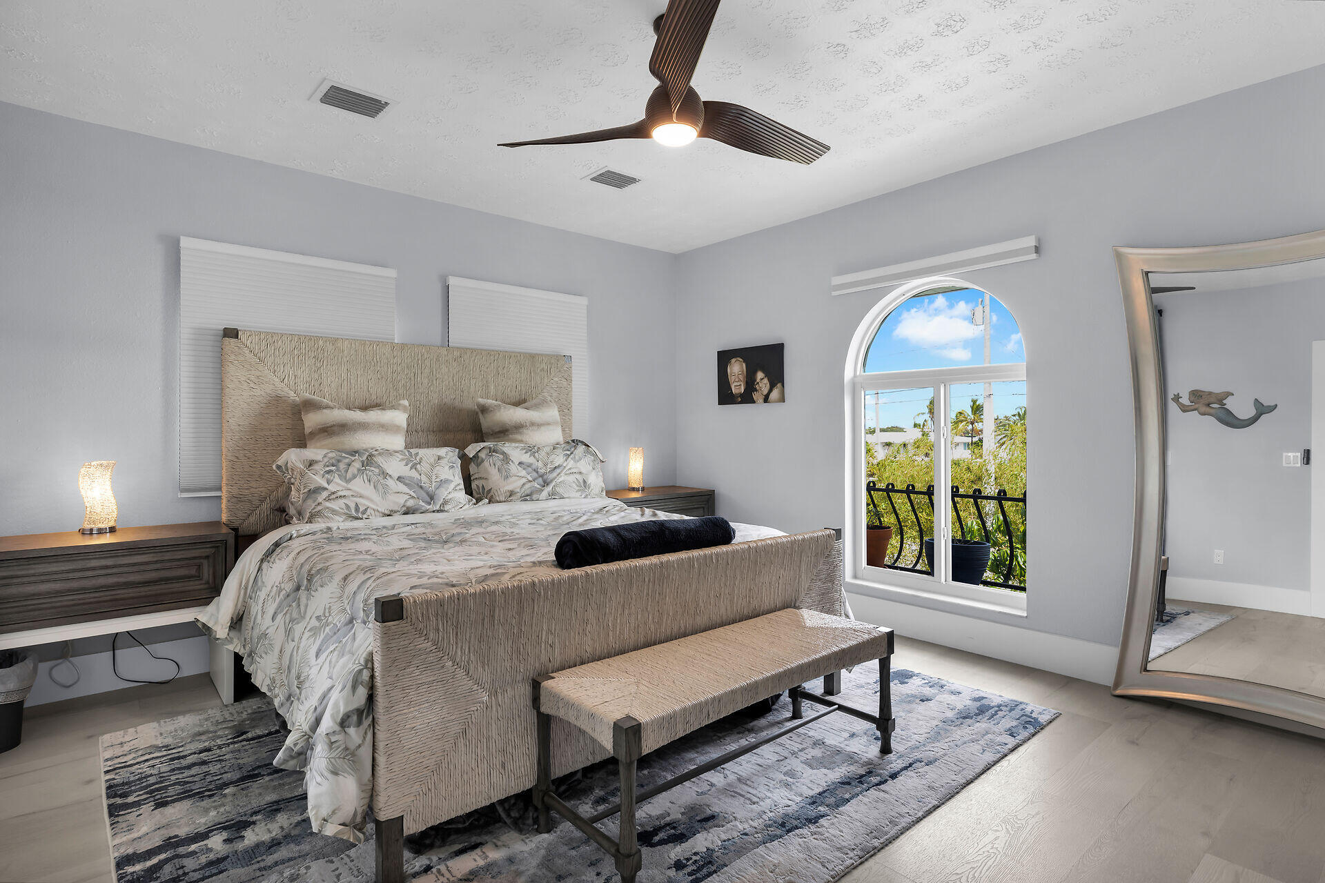 30363 Flamingo Lane Big Pine Key, FL 33043 - Photo 25 of 43 a bedroom with a bed and a chandelier