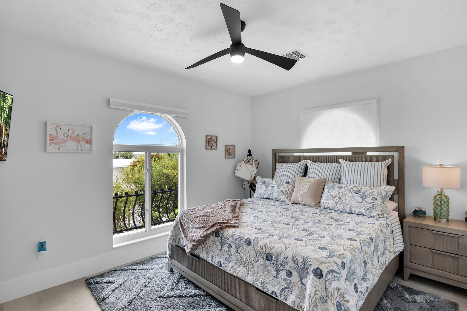 30363 Flamingo Lane Big Pine Key, FL 33043 - Photo 28 of 43 a bedroom with a large bed and a window