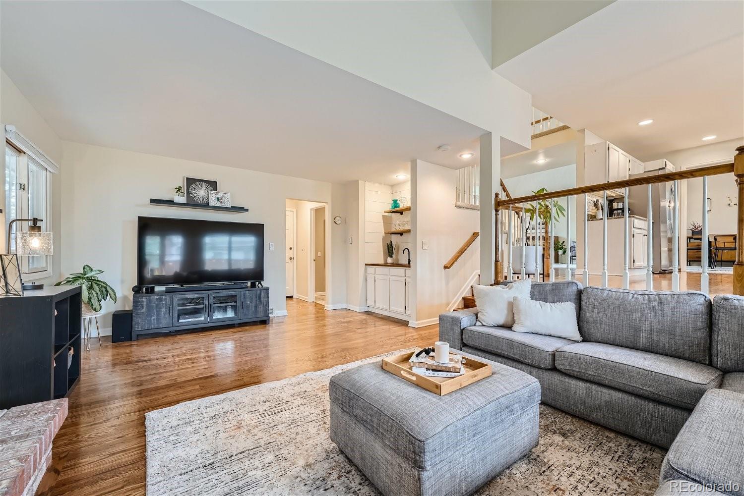 16671 East Prentice Circle Centennial, CO 80015 - Photo 15 of 40 a living room with furniture and a flat screen tv