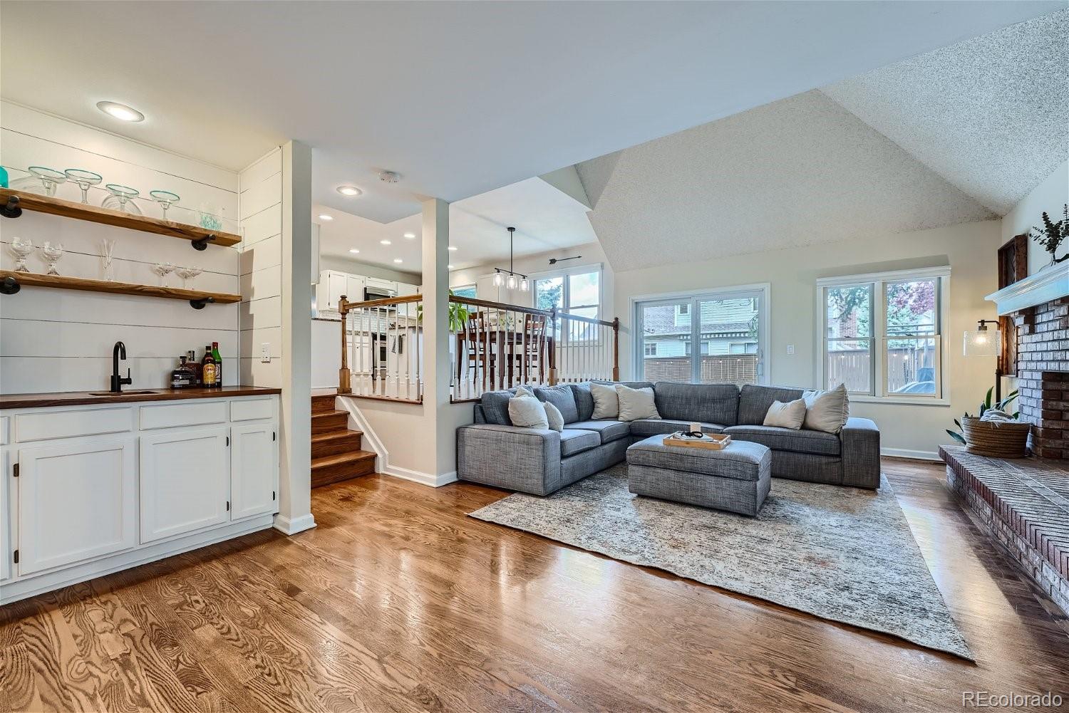 16671 East Prentice Circle Centennial, CO 80015 - Photo 16 of 40 a living room with furniture and a wooden floor