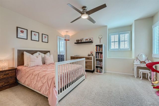 a bedroom with bed and a window