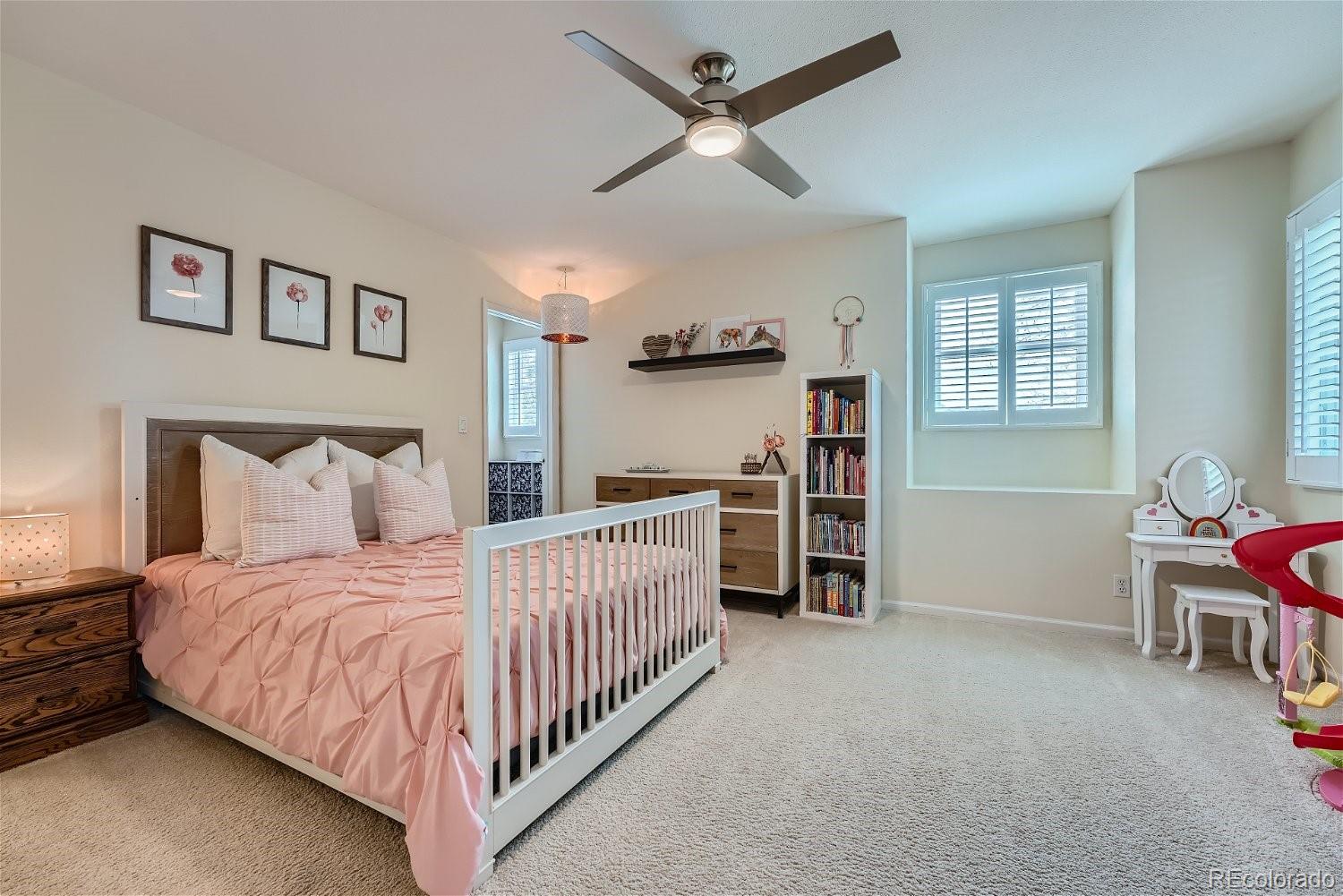 16671 East Prentice Circle Centennial, CO 80015 - Photo 20 of 40 a bedroom with bed and a window