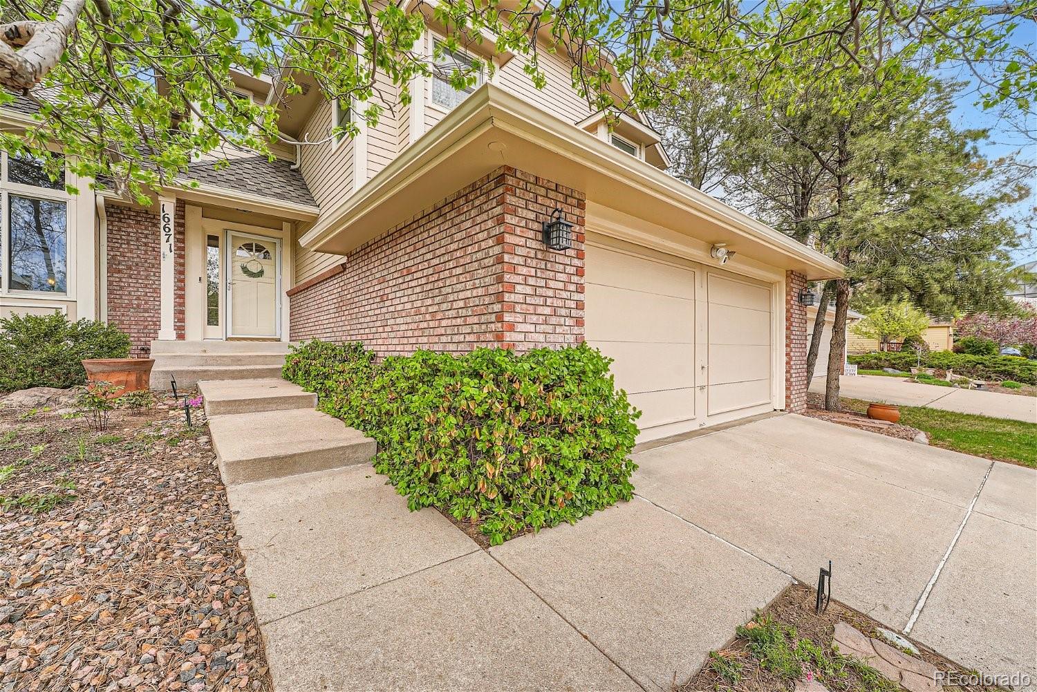 16671 East Prentice Circle Centennial, CO 80015 - Photo 2 of 40 a view of a house with a yard