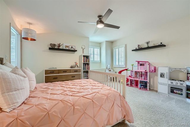 a bedroom with bed and a window