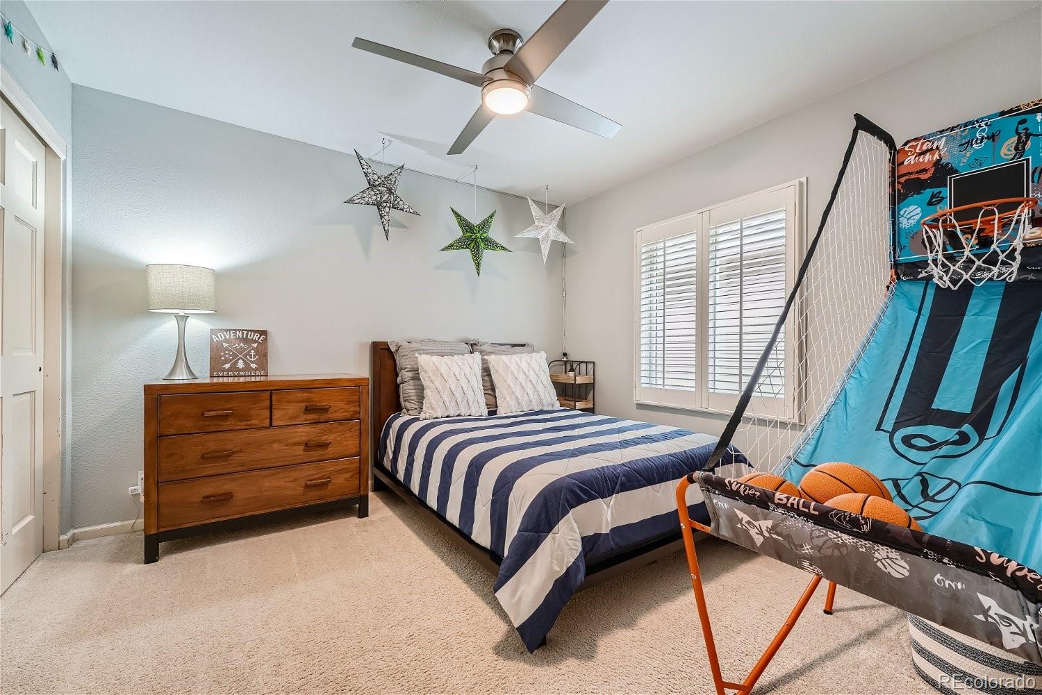 16671 East Prentice Circle Centennial, CO 80015 - Photo 23 of 40 a bedroom with bed and a window