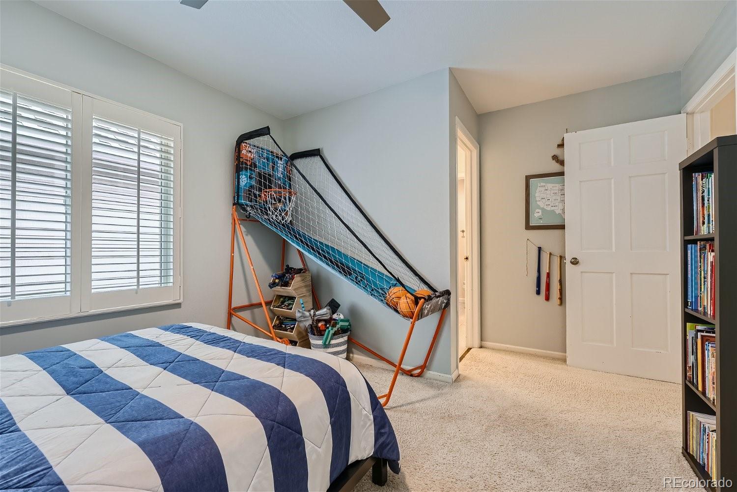 16671 East Prentice Circle Centennial, CO 80015 - Photo 24 of 40 a bedroom with bed and a window