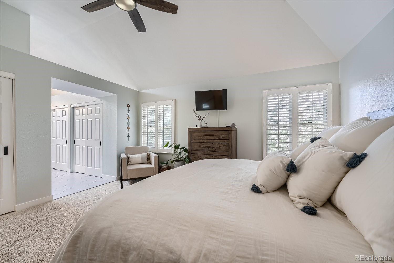 16671 East Prentice Circle Centennial, CO 80015 - Photo 28 of 40 a bedroom with a bed and couch