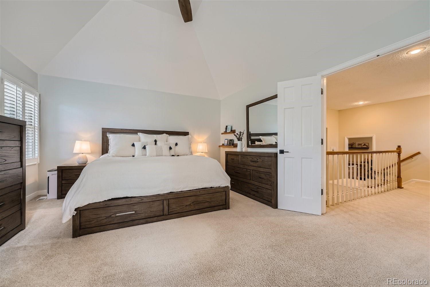 16671 East Prentice Circle Centennial, CO 80015 - Photo 29 of 40 a spacious bedroom with a bed and a cabinets