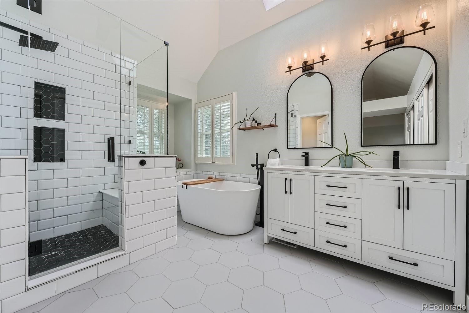 16671 East Prentice Circle Centennial, CO 80015 - Photo 30 of 40 a bathroom with a double vanity sink mirror and bathtub
