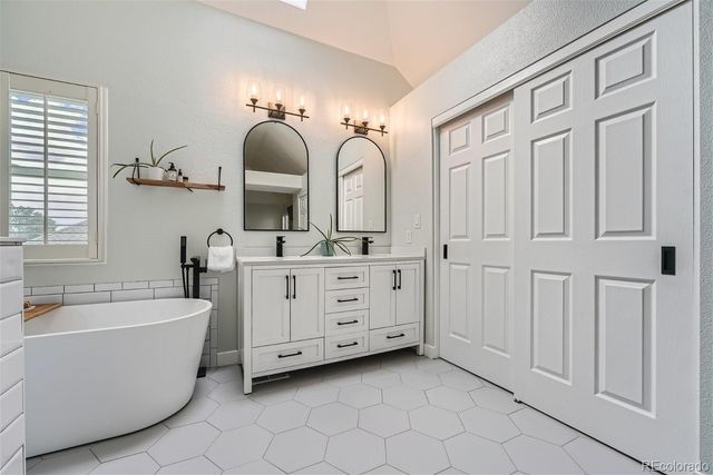 a bathroom with a bathtub and shower