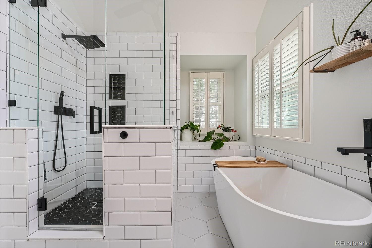 16671 East Prentice Circle Centennial, CO 80015 - Photo 32 of 40 a bathroom with a bathtub and shower